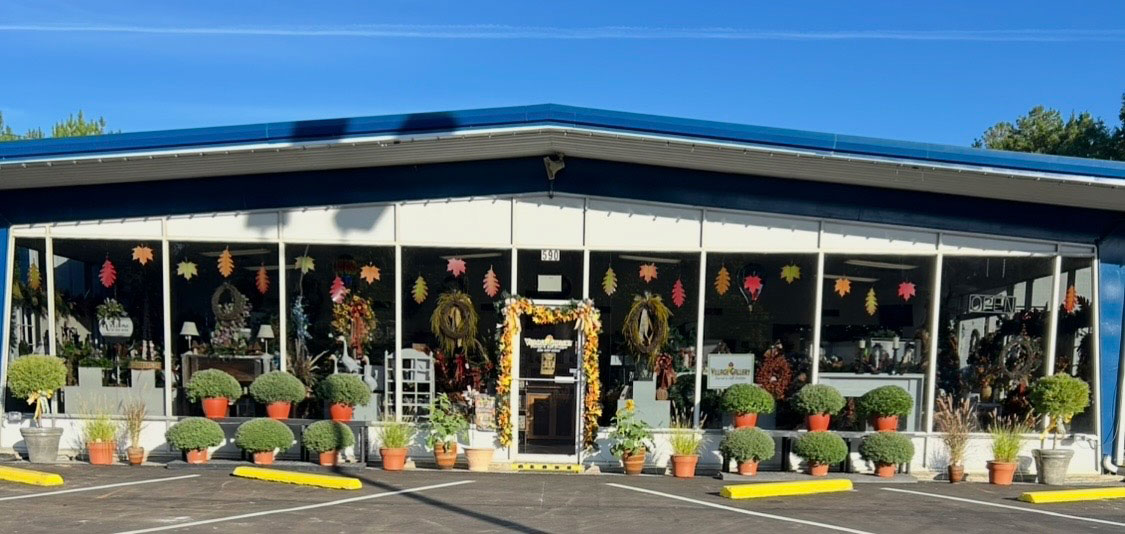 Village Gallery Florist and Gift Shoppe storefront decorated for fall